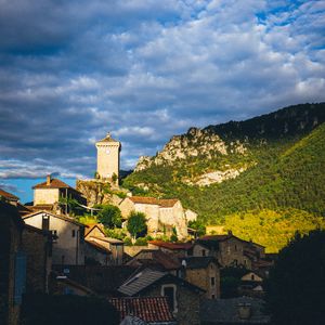 Preview wallpaper village, houses, mountains, trees, clouds, green, blue