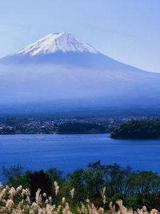 Preview wallpaper volcano, clouds, coast, top, city, water, grass