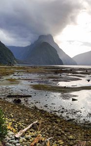 Preview wallpaper volcano, mountains, clouds, lake, pebbles