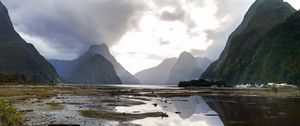 Preview wallpaper volcano, mountains, clouds, lake, pebbles