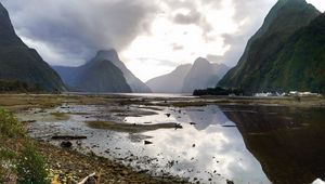 Preview wallpaper volcano, mountains, clouds, lake, pebbles