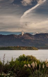 Preview wallpaper volcano, mountains, grass, sea