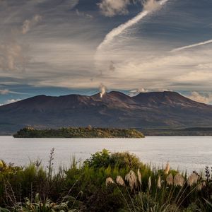 Preview wallpaper volcano, mountains, grass, sea