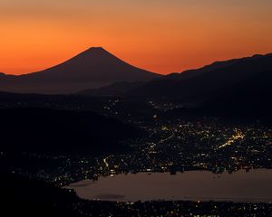 Preview wallpaper volcano, mountains, hills, lights, evening