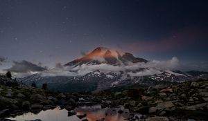 Preview wallpaper volcano, snow, snowy, stones, lake