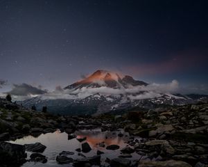 Preview wallpaper volcano, snow, snowy, stones, lake