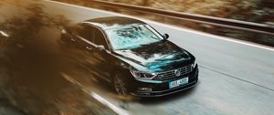 Preview wallpaper volkswagen, car, black, business class, road, asphalt, movement