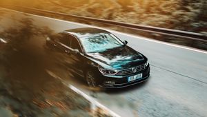 Preview wallpaper volkswagen, car, black, business class, road, asphalt, movement