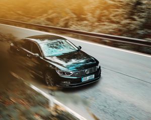 Preview wallpaper volkswagen, car, black, business class, road, asphalt, movement