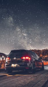Preview wallpaper volkswagen, car, rear view, headlights, starry sky