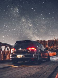 Preview wallpaper volkswagen, car, rear view, headlights, starry sky