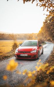 Preview wallpaper volkswagen golf gti, volkswagen, car, red, front view, road, nature