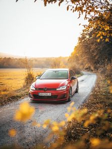 Preview wallpaper volkswagen golf gti, volkswagen, car, red, front view, road, nature