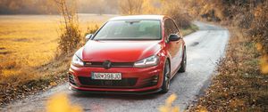 Preview wallpaper volkswagen golf gti, volkswagen, car, red, front view, road, nature