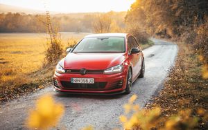 Preview wallpaper volkswagen golf gti, volkswagen, car, red, front view, road, nature