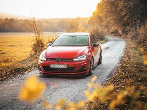 Preview wallpaper volkswagen golf gti, volkswagen, car, red, front view, road, nature