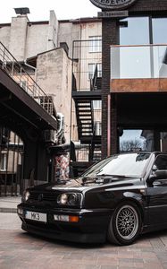 Preview wallpaper volkswagen golf, volkswagen, car, black, buildings