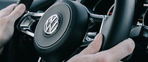 Preview wallpaper volkswagen, steering wheel, hands, car