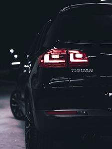 Preview wallpaper volkswagen tiguan, volkswagen, car, black, rear view, lights, backlight