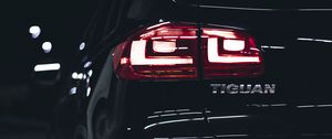 Preview wallpaper volkswagen tiguan, volkswagen, car, black, rear view, lights, backlight