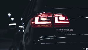 Preview wallpaper volkswagen tiguan, volkswagen, car, black, rear view, lights, backlight