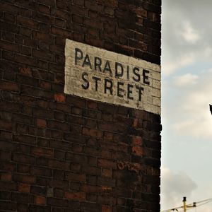 Preview wallpaper wall, inscription, brick, sign, street