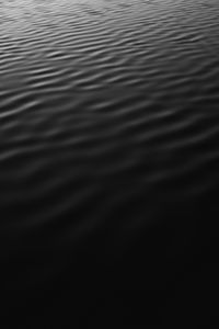 Preview wallpaper water, black, ripples, sea