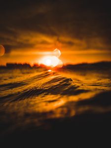 Preview wallpaper water, glare, bokeh, sunset, blur