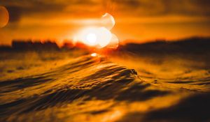 Preview wallpaper water, glare, bokeh, sunset, blur