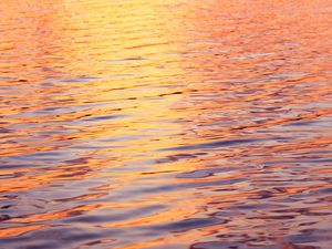 Preview wallpaper water, glare, ripples, sunset, waves