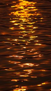 Preview wallpaper water, glare, sunset, ripples