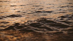 Preview wallpaper water, glare, waves, wavy, ripples, sunset