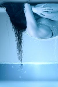 Preview wallpaper water, hair, girl, room, lies, loneliness, ceiling, bubbles