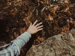 Preview wallpaper water, hand, stones, touch, transparent