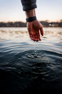 Preview wallpaper water, hand, touch, drops, ripples