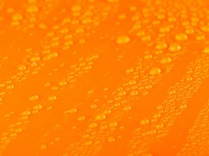 Preview wallpaper water, liquid, drops, macro, orange