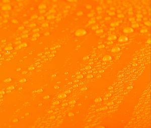 Preview wallpaper water, liquid, drops, macro, orange