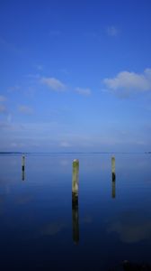 Preview wallpaper water, pillars, horizon, sky, reflection