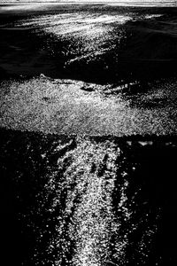 Preview wallpaper water, sea, ripples, glare, bw, dark