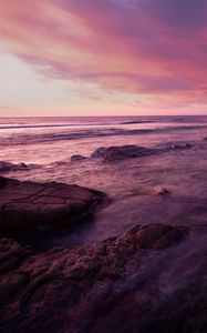 Preview wallpaper water, sea, stones, landscape, sunset, purple