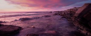 Preview wallpaper water, sea, stones, landscape, sunset, purple