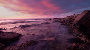 Preview wallpaper water, sea, stones, landscape, sunset, purple