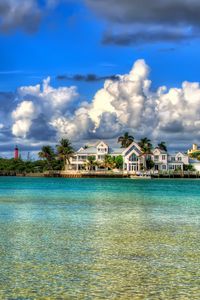 Preview wallpaper water, sky, clouds, houses