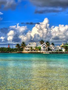 Preview wallpaper water, sky, clouds, houses