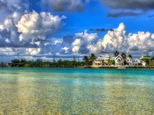 Preview wallpaper water, sky, clouds, houses