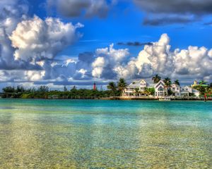 Preview wallpaper water, sky, clouds, houses