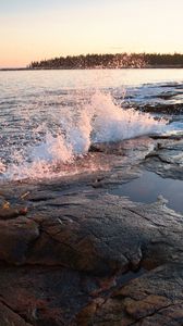 Preview wallpaper water, spray, shore, stones, sunset