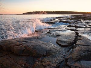 Preview wallpaper water, spray, shore, stones, sunset