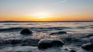 Preview wallpaper water, stones, sunset, horizon, landscape