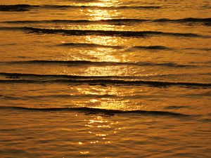 Preview wallpaper water, waves, glare, sunset, dark